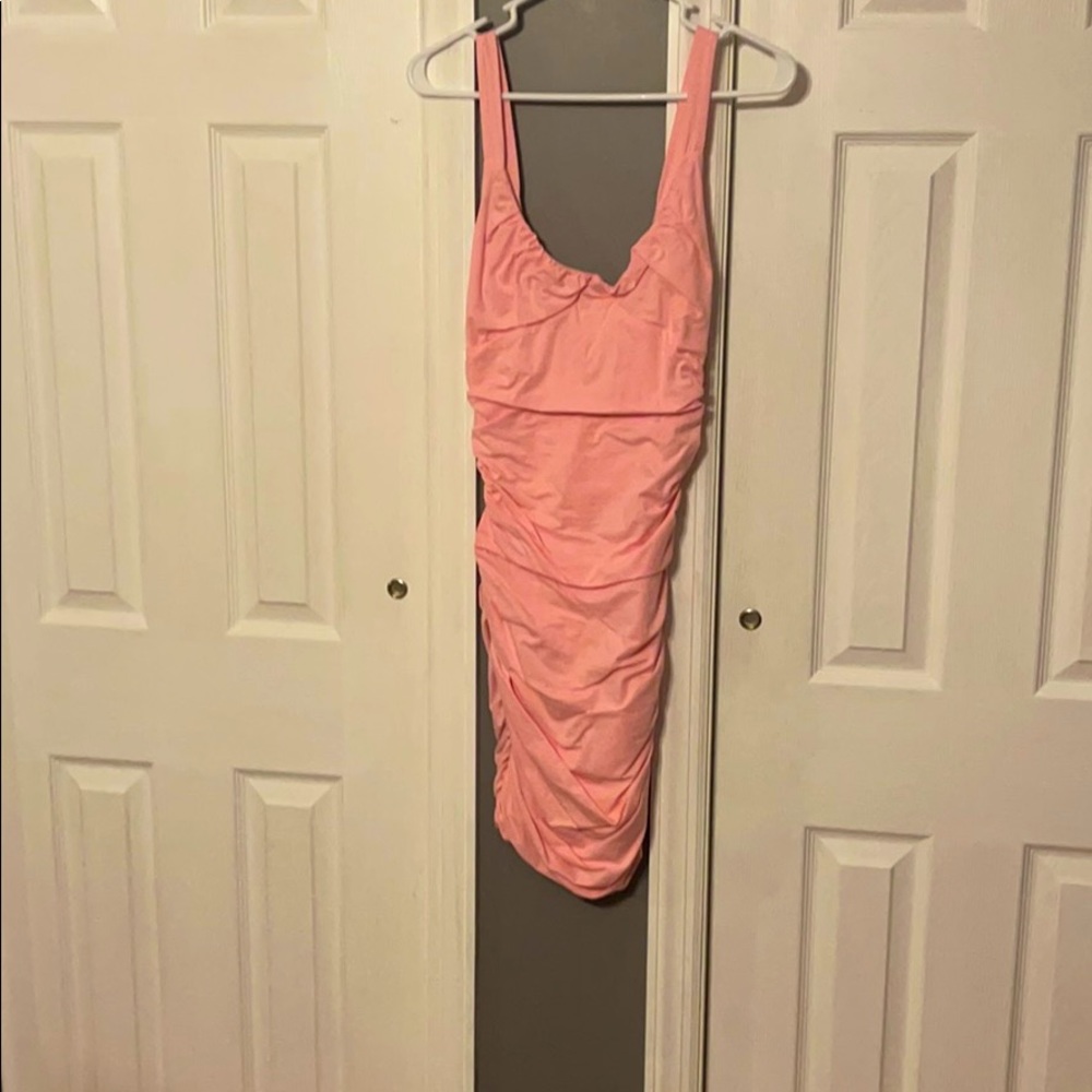 Never worn.  Tiger mist size small